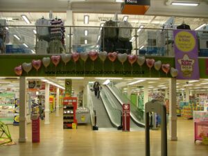 Corporate foil heart balloon arch